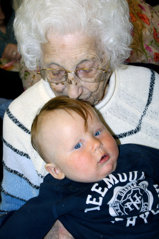 Mary Sesso, 105, with her great grandson, Robert Przybilla, 7 months. The two had their first tea together at the Wesley United Methodist Church's spring event.