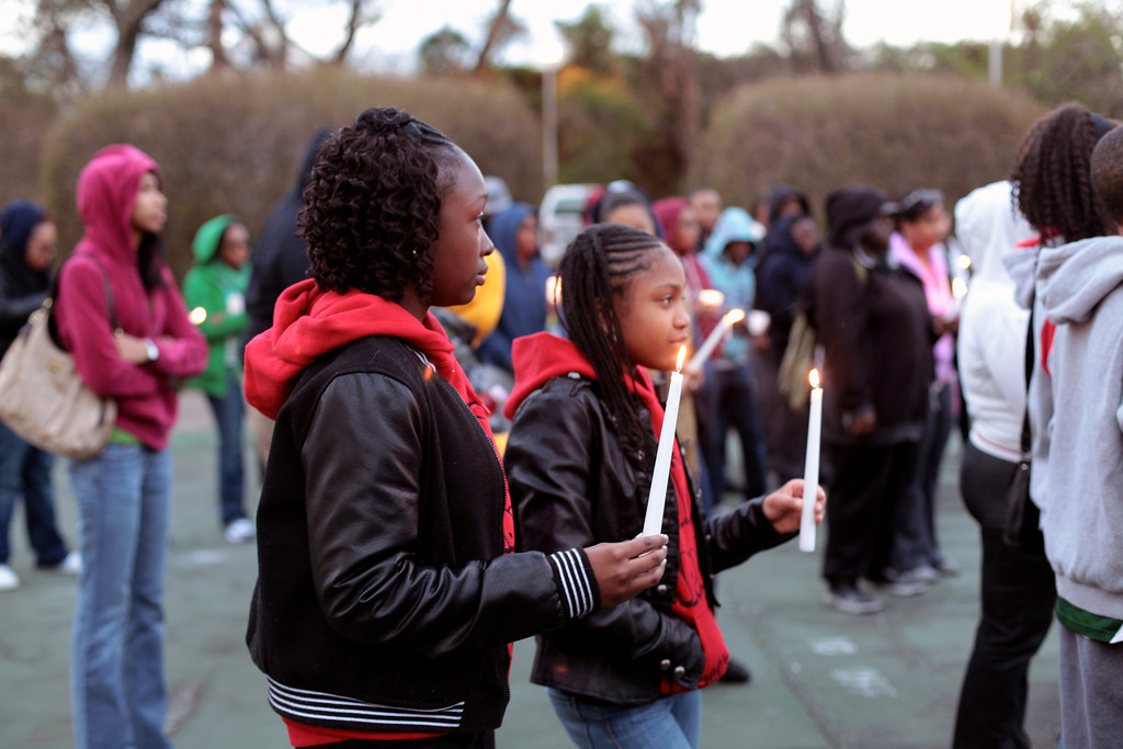 Essence Hogan, 13, left, and Olyvia Siclait, 12, both local students, attended the vigil for Martin together.
