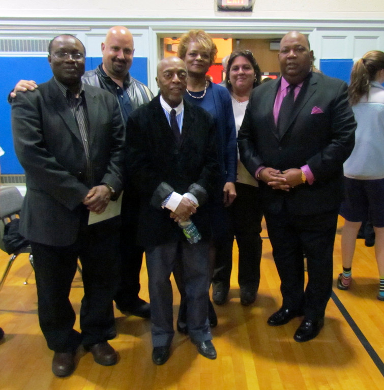 Haynes posed with Elmont Union Free School District Superintendent Al Harper and the district's Board of Education members.