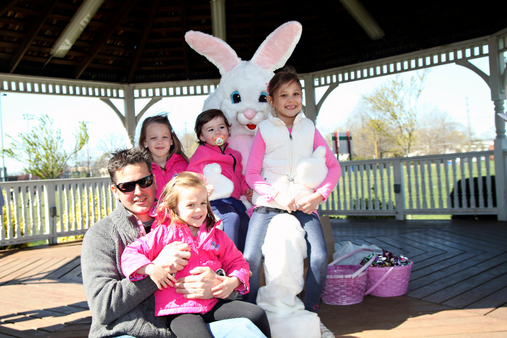 Olivia and Sofia Romanowski, 5 and 3, (top and bottom left), joined Nicolette and Alexis Raynor, 2, and 5, (top middle and top right), for a picture with the Easter bunny.