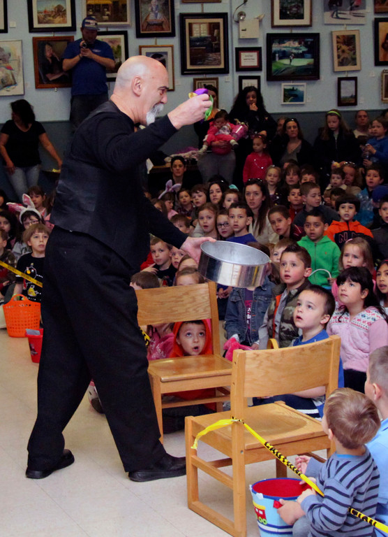 Magician John performed astounding tricks that amazed the entire room full of children in Lynbrook.