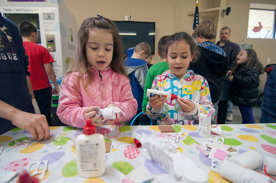 Two girls participated in arts and crafts after to the Easter egg hunt in East Rockaway.