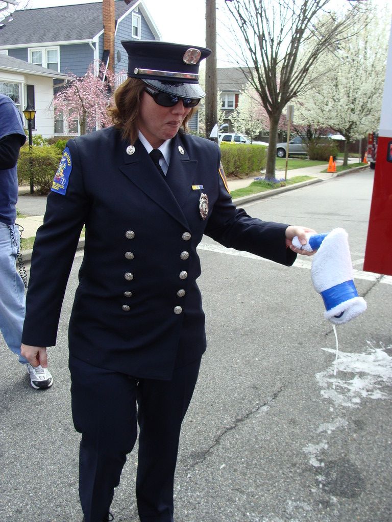 ex-Captain Patty Seifert smacked the new ambulance with a bottle of bubbly in photo at immediate right.