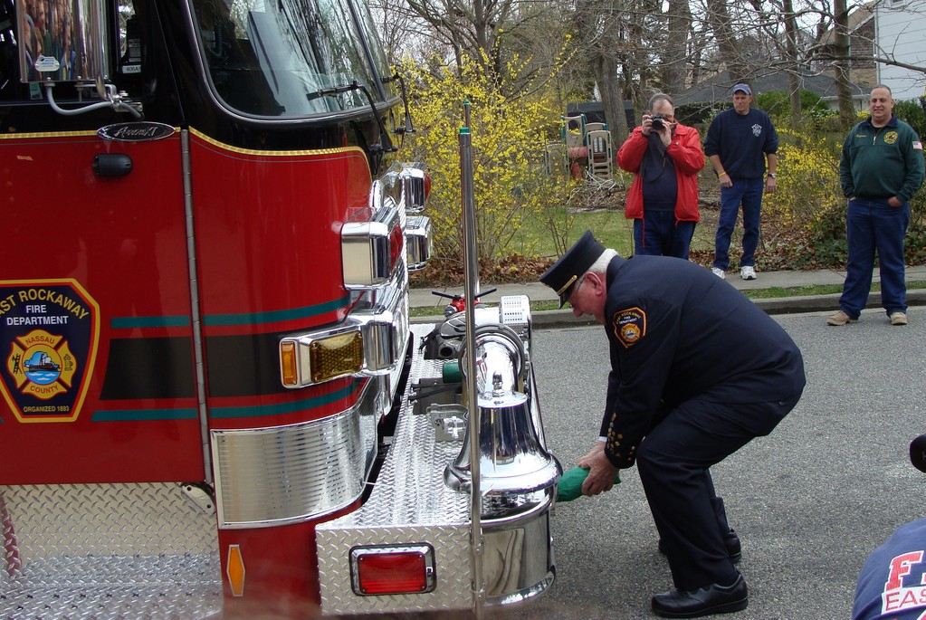 Honorary Chief Fred Weiss, above, christened the new fire pumper in front of the Liberty Hose Co. No. 2 on Clark Street on March 28.