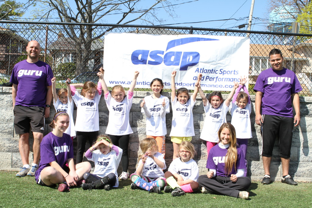 A preschool and kindergarten girls group practiced with coaches Stephan and Leigh.
