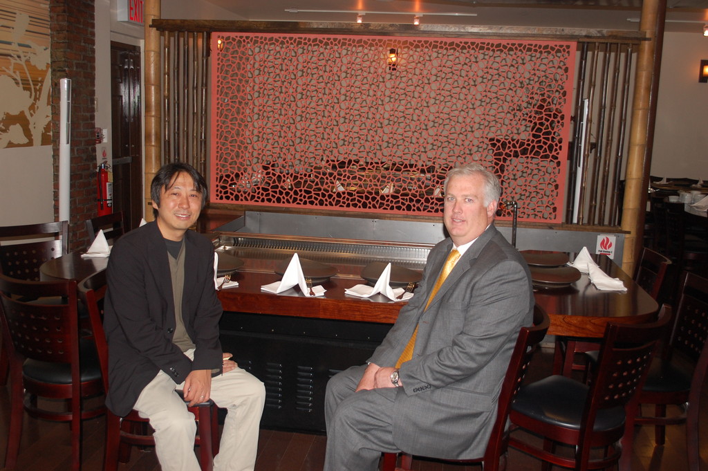 Owner Keiji Inatome, left, and Valley Stream Building Superintendent Thomas McAleer sat at one of the downdraft hibachi grills at the recently reopened Inatome Restaurant.