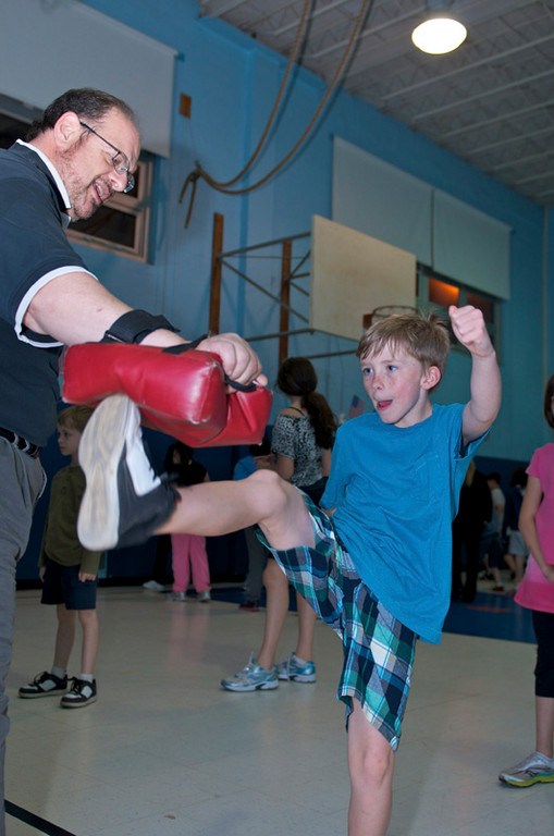 Hunter Pitkowsky, 10, practiced his new kick boxing moves at Fitness Night at School 4.