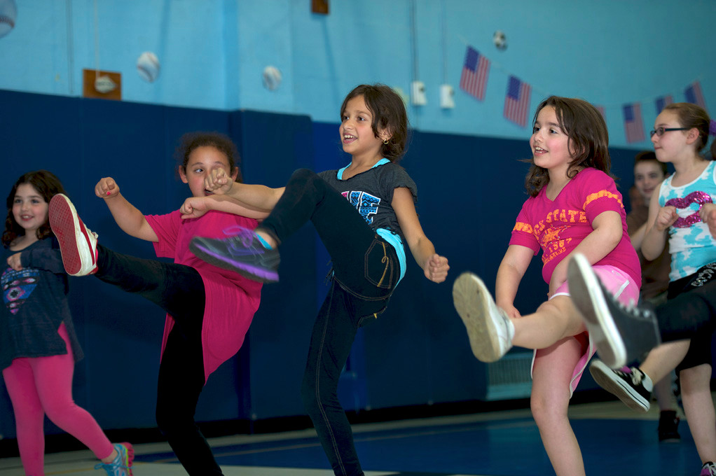 Brielle Nolan, second from left, Jillian Jeacoma and Rachel Ronan practiced their kickboxing moves at Family Fun and Fitness Night at School 4 last Friday.