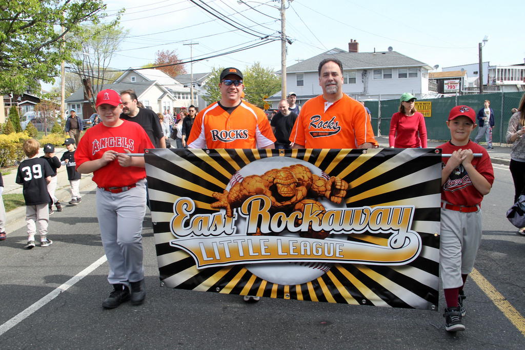 Little leaguers Christian Maltempi, left and Chris Perri led the parade with 1st VP Tom La Barbara and President Mike Cilluffo.