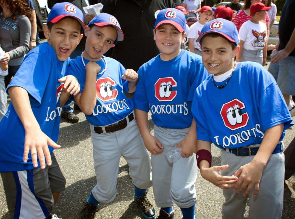 Members of the Franklin Square Lookouts, Mark Roder, from left, Mark Spano, Andrew Scarpinito and Jonathan Porcaro, joked around before gearing up for their Opening Day game.
