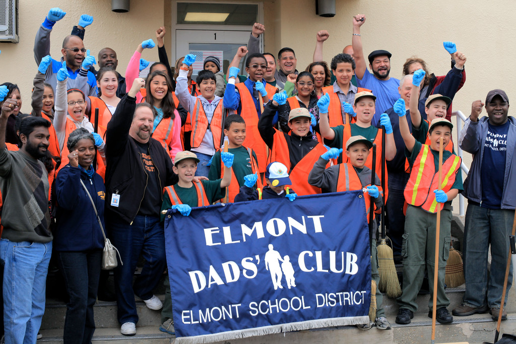 Locals cheered after completing “Clean Up Elmont Day,” an event organized by the Elmont Dad’s Club, held last Saturday.
