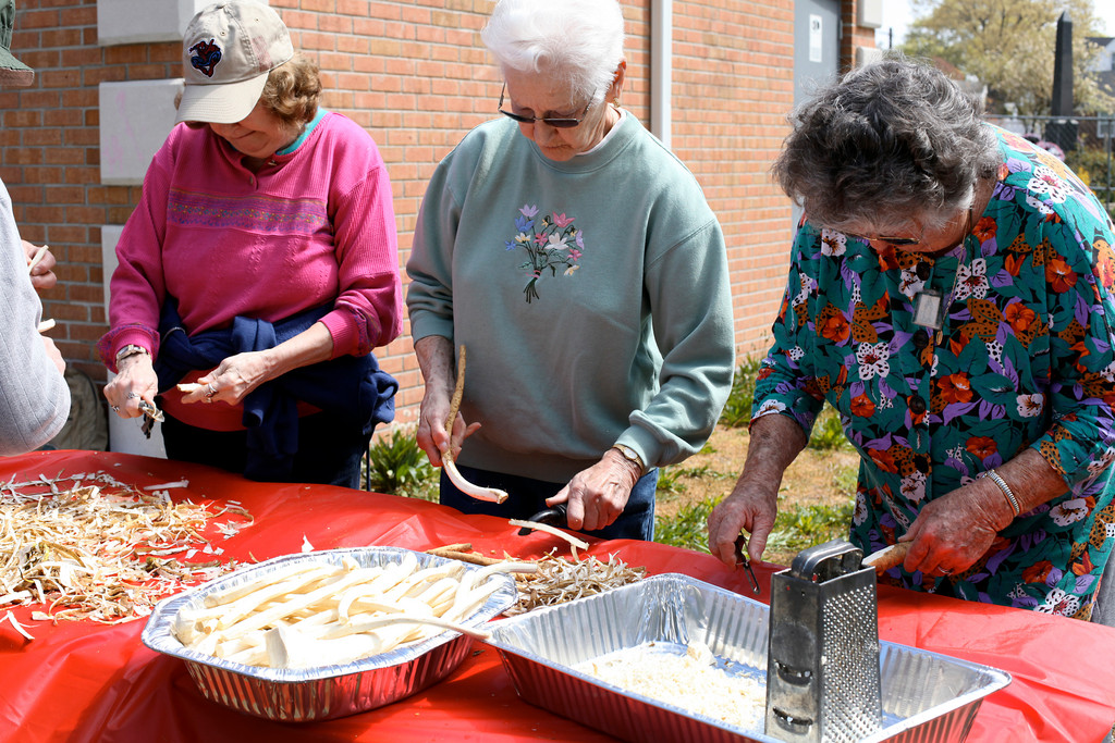 Carolyn Rottkamp of Bellmore, Mary Gabriel of Dix Hills, and Maria Maglio of Melville were all smiles while peeling horseradishes a the Franklin Square Historical Center's annual horseradish-making event on April 21.