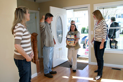 Local Girl Scouts brought housewarming gifts to the Clarkin family of Mineola on March 30.