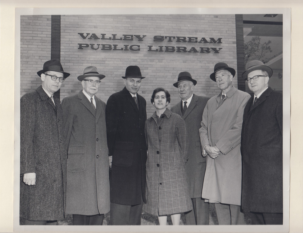Village and Library officials at the new building on Nov. 17, 1962, following the ceremony to lay the cornerstone. From left were Library Board President George Wandell, Mayor Henry Waldinger, library Trustee Alan Yeo, Director Caroline Fitz and trustees Thomas Holman, Henry Carr and Edward Kurfess.