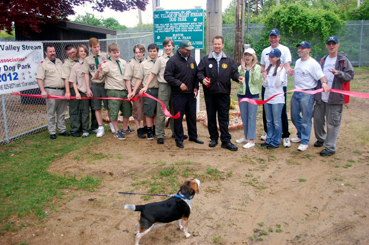 Members of the village, Friends of the Valley Stream Dog Park group and Scouts cut the ribbon for the new facility.