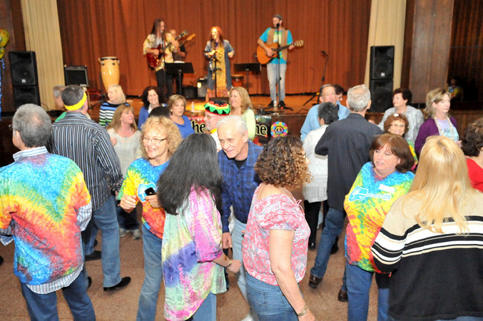 Lost in the 60s again! Partygoers danced to the music, provided by folk group “Gathering Time, at Temple Am Echad in Lynbrook.