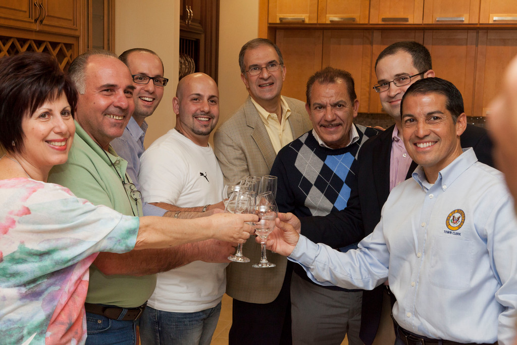 Maria Altesi, left, Sal Altesi, KW Kitchens owners Danny and Vito Altesi, County Legislator Vincent Muscarella, Vinny Mammola, State Assemblyman Ed Ra and Town of Hempstead Clerk Mark Bonilla toasted to a new business.