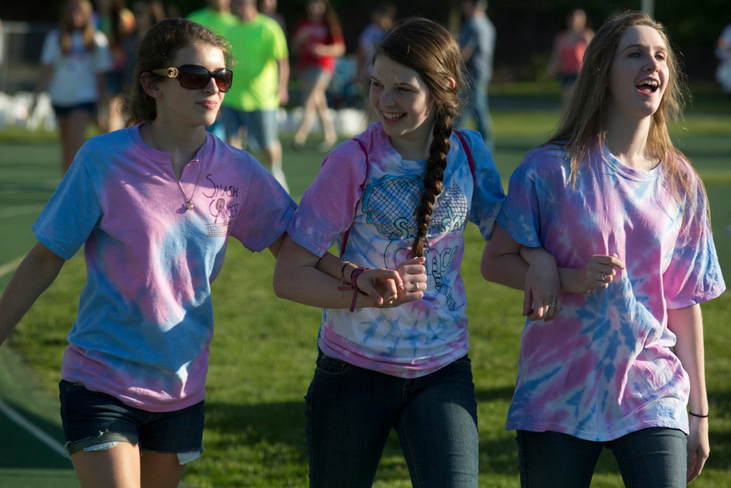Caitlin Dixon, Courtney Jackson and Tara Connor walked arm-in-arm during the 2012 relay for life event at South Middle School in Lynbrook.