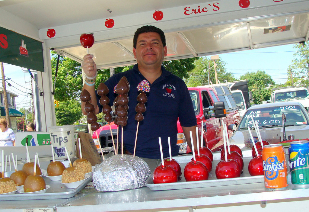 A booth with candy apples and chocolate-covered strawberries. Yum!