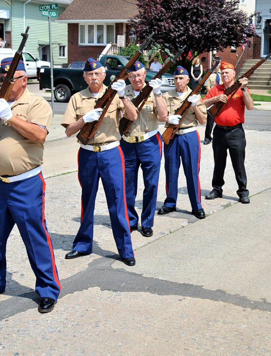 A five-gun salute by, from left, Dom Longobardi, USMC Cold War; Bernie Dunetzm, USMC World War II; Sam Femminello, USMC Korea; Nick Camarano, USMC Cold War: and Len Goldstein, USMC Cuban Missle Crisis.