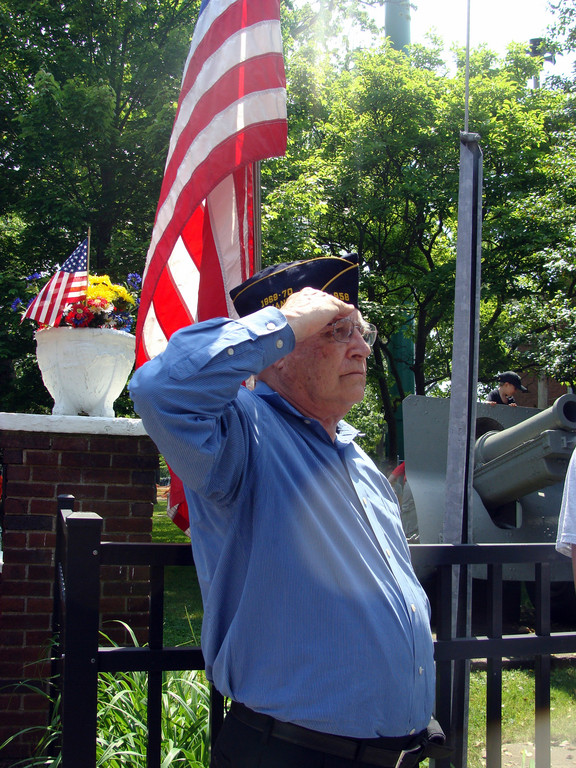 John Brueggemann, a 50-year member and past commander of the American Legion Post in East Rockaway, saluted.