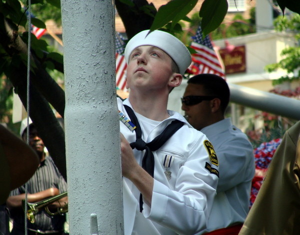 Sea Cadet Teddy Sieban raised and then lowered the flag.