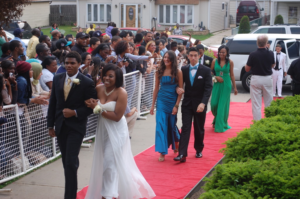 Happy couples walked along the red carpet after emerging from their limos at Central High School.