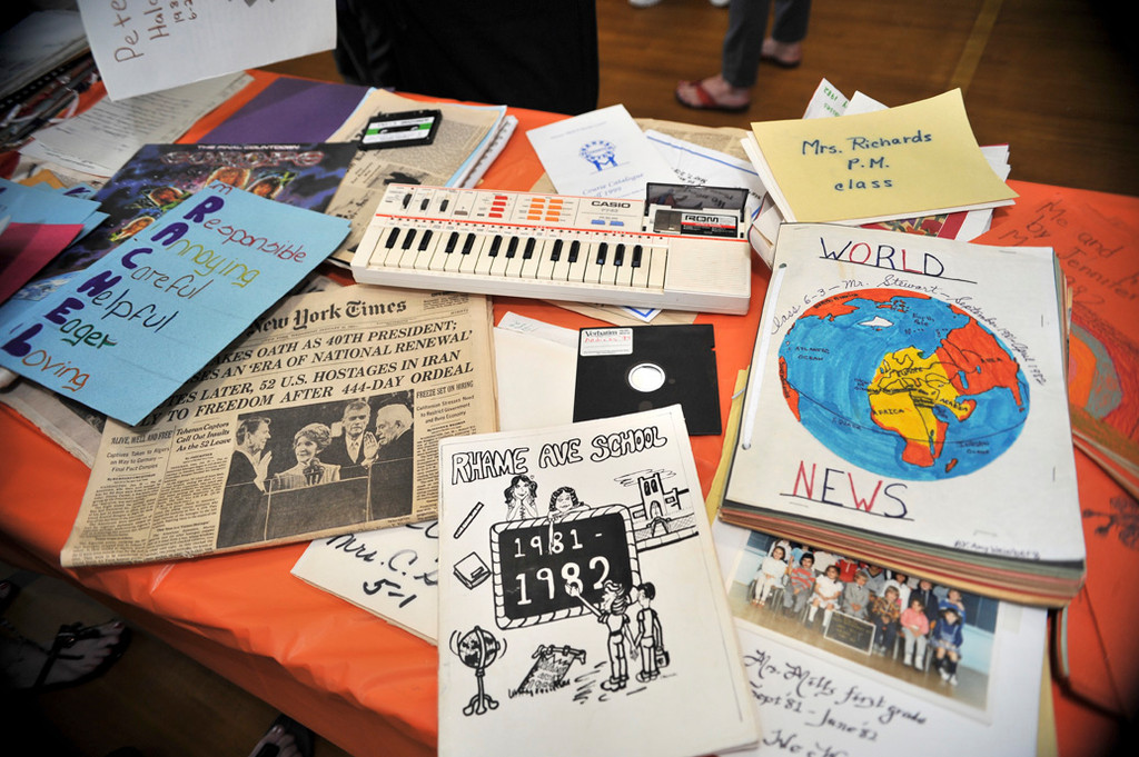 Artifacts from 1982 included newspapers, cassette tapes, drawings, reports and class photos.