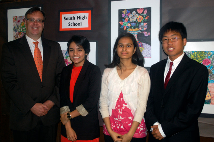 South High School valedictorian Mitchelle Joseph, second from left, and co-salutatorians Mariyam Qureshi and David Li are joined by Superintendent Dr. Bill Heidenreich.