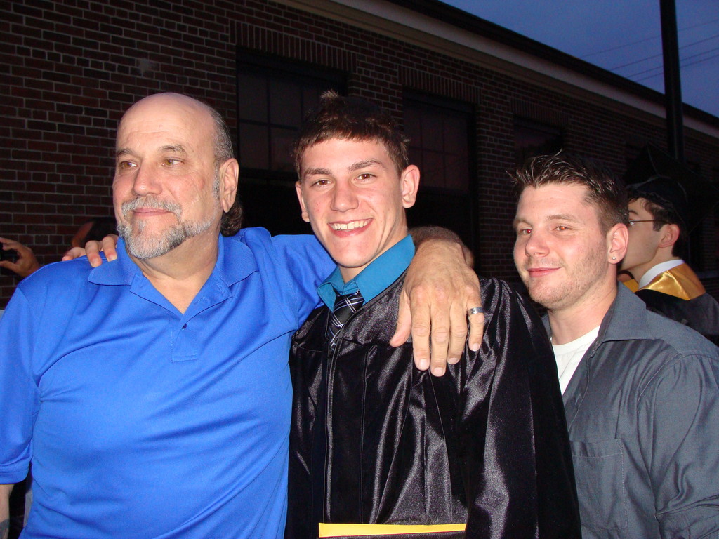East Rockaway Graduate Luke Fahrenkrug was congratulated by his father, George Fahrenkrug, left, and his brother, Chris Luzon.