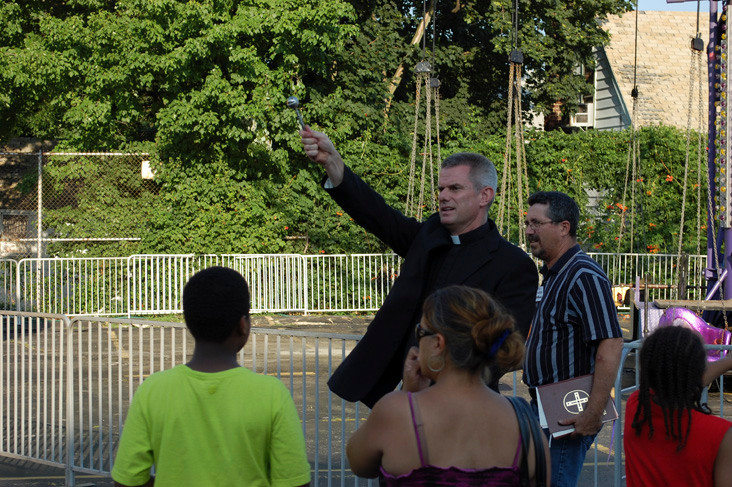 The Rev. Peter Dugandzic, pastor of Blessed Sacrament Church, began the four-day 
celebration by blessing fair-goers with holy water on Thursday evening.