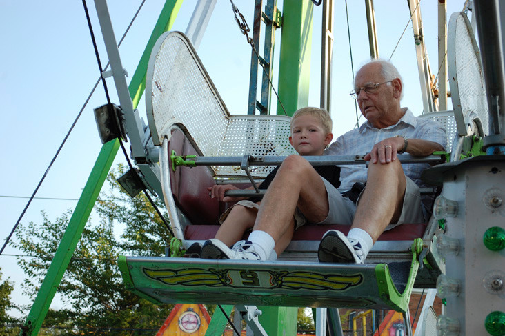 Alan Morton and his grandson, Jackson, 6, ride the Ferris wheel.