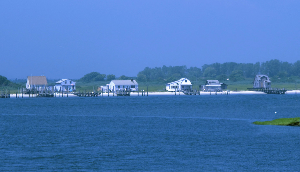 A series of Bay Houses sit on Meadow Island, a privately owned stretch of sand visible off the Loop Parkway near Point Lookout. The island was settled by the Doxsee family in the 1950s.
