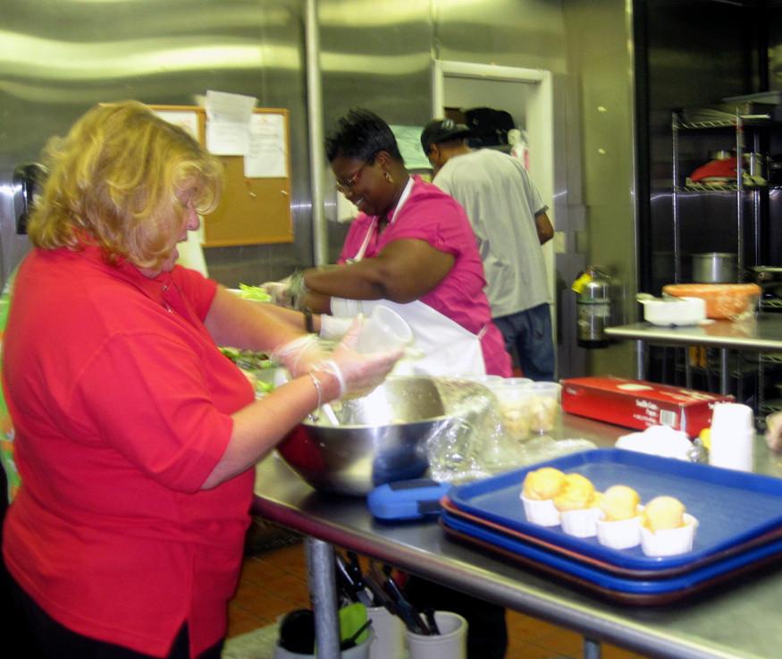 MaryEllen Volpe and Stephanie Craig helped prepare and serve food with the Interfaith Nutrition Network.