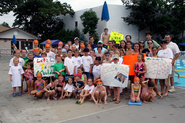 Swimmers, coordinators and state and local officials gathered in support of Swim Across America at the Lynbrook Pool.