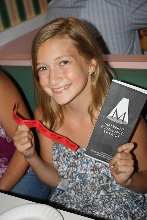 Olivia St. John, 12, of Malverne, showed off her raffle ticket at the event.