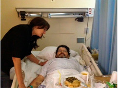 Courtesy Estelle Riviera/LFD
Lynbrook Fire Department EMT Lynn Curtis visited Hugo Gallardo in his hospital bed at NCUMC last Thursday.