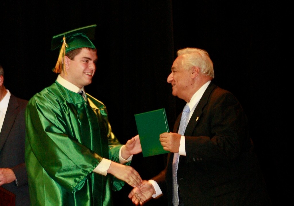 Dr. Barbarino presented a 2012 Lynbrook High School graduate with his diploma in June.