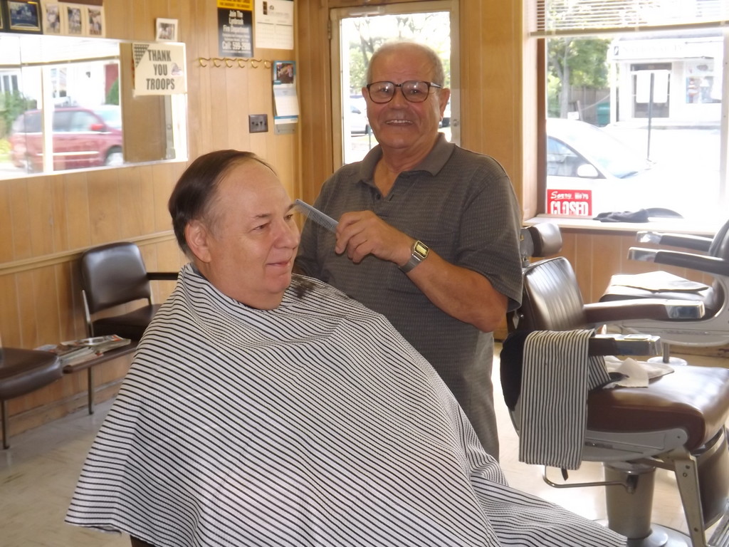Charlie “the Greek” costani has been working at Eddie’s for nearly 30 years. Sam Sheiman is in the chair.