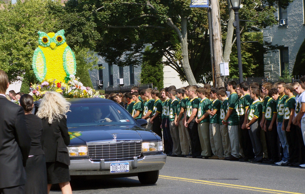 Hundreds of students lined both sides of Atlantic Avenue to pay tribute to their superintendent, Santo Barbarino.