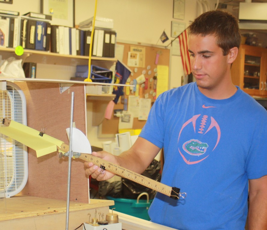 Lynbrook High School senior Edward Tischler built an apparatus to study and improve the aerodynamic properties of the human wing suit.