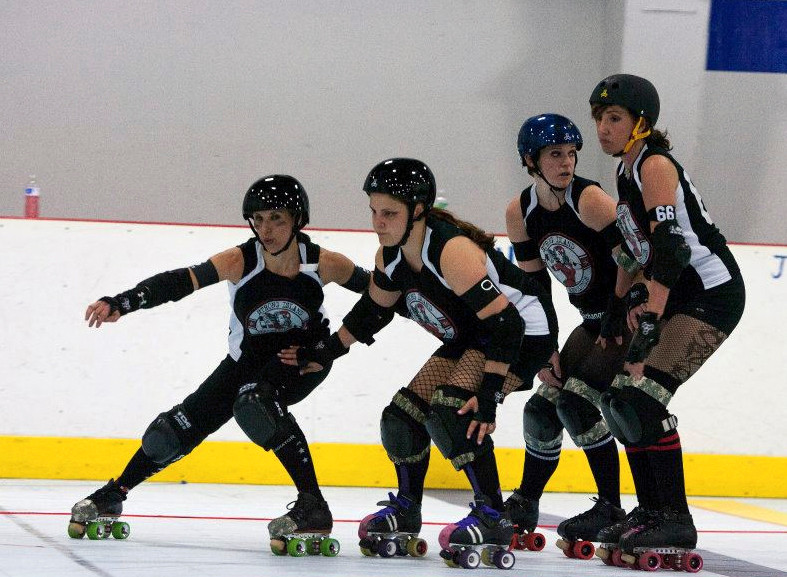 Roller derby player/coach Andrea Bucciano, second from left above, lives a double life. At home in Baldwin she’s a vegetarian book club hostess, but on the rink she is “Mean Frostine.”