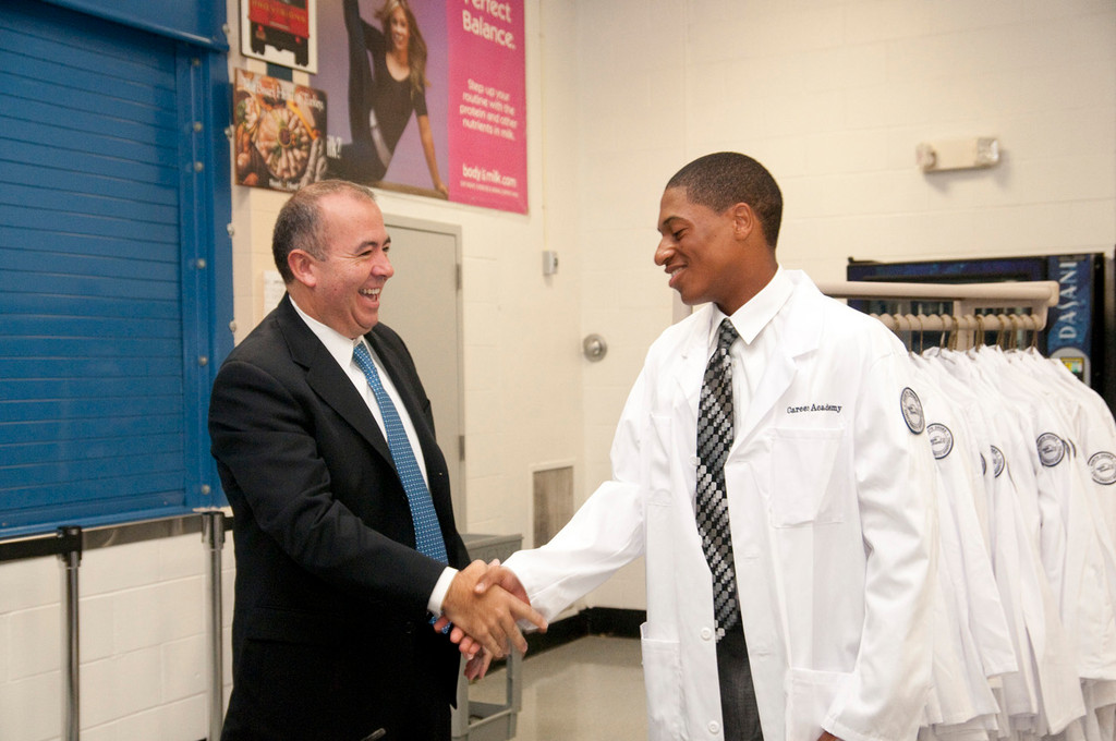 Joseph Cabral, left, of North shore LIJ, congratulated BHS’s Tyler Warner at a “White Coat” ceremony last week, similar to those held at medical schools.