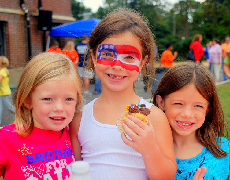 Students Emma Kelly, Katie LaBarbera and Meghan Kelly took advantage of the face painting and the sweet snacks at the annual Centre Avenue Elementary School Back to School