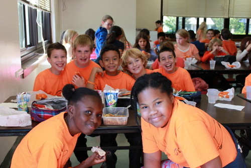 Students from Mrs. Donna Smith's fifth grade class showing off their Unity Day shirts at Orange Bagel lunch