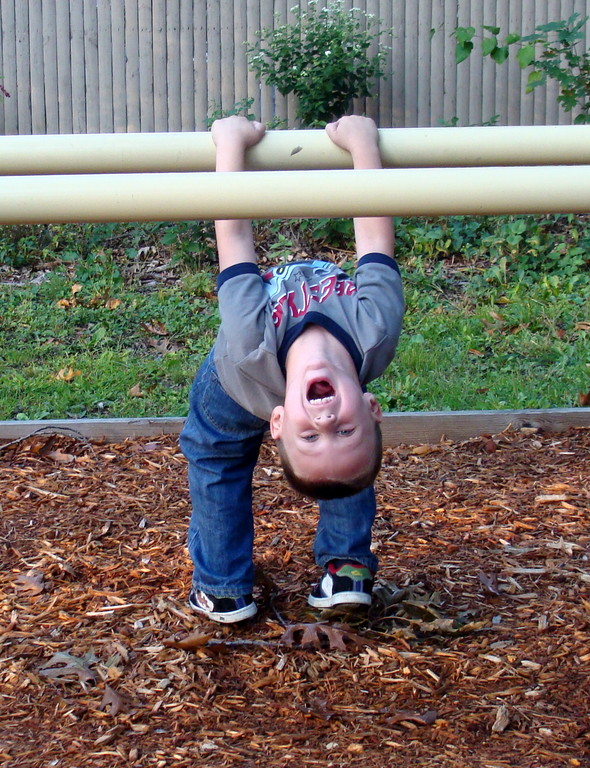 Shane practiced his stretching — and shouting — on the parallel bars.