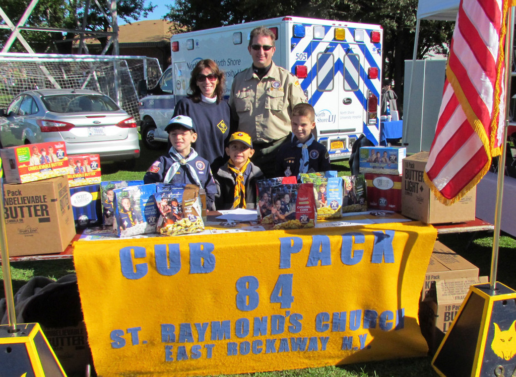 Lynbrook/East Rockaway Cub Scout Pack 84 sold popcorn and pretzels. Pictured were Joseph Carinci, 8, left, Nicholas Curra, 7, and Nicholas Flammia, 8. Cub Master Ed Shaw, standing right, and Patricia Carinci, Committee Pack Member, assisted the boys with their sales Expo.
