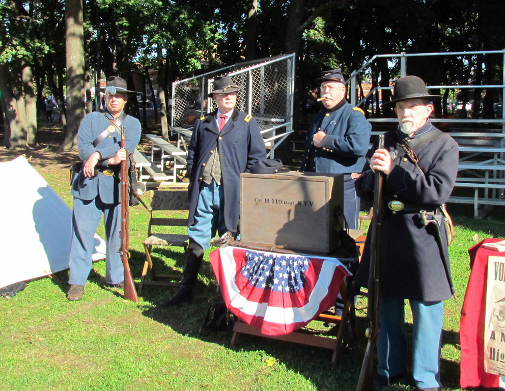 Being civil: Members of the 119th New York Volunteers Historical Association dressed in Civil War attire at the Lynbrook Expo. From left to right, Bill DeGeorge as an infantryman, Guy Smith as a Lieutenant, Mark Adler as a Captain, and Jack Murphy as a Private.