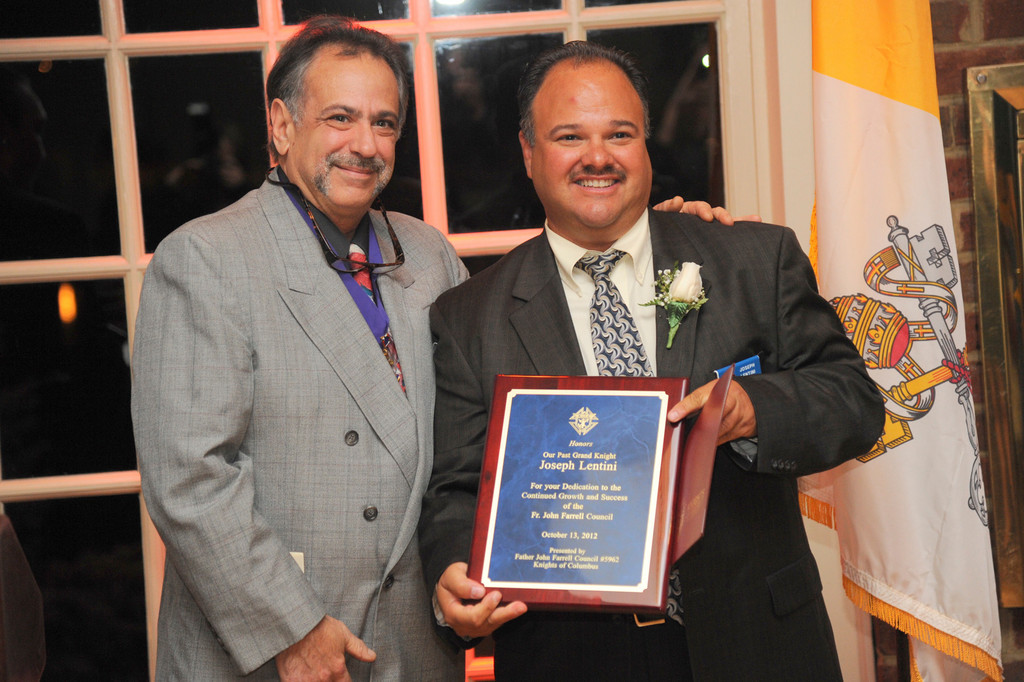Current Grand Knight Peter Chiofolo presented most recent past Grand Knight Joseph Lentini with an award that recognized his service to the KoC.