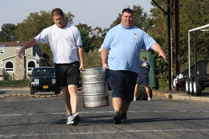 Keith Eckels, left, and Kevin Smith now tote kegs for reasons other than personal enjoyment.